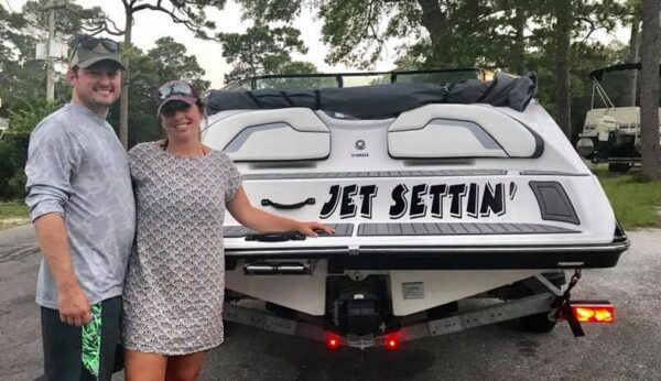 A Couple With a Jet Setting Sticker on a Car